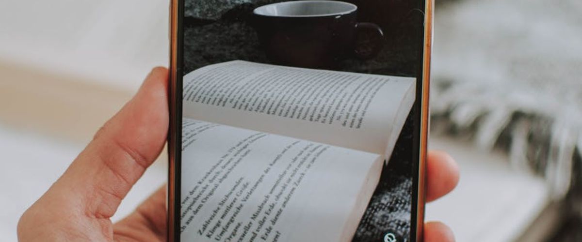 Various people reading books and digital screens comfortably